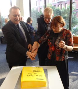 Geoff Hinchcliffe, David Roberts and Barbara Reed cutting the AS 4390 20th anniversary cake